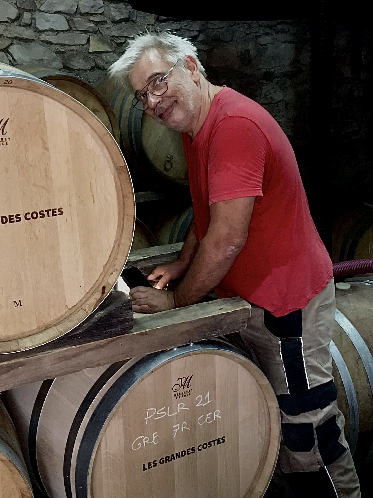 Jean-Christophe Granier racks barrels of his wine