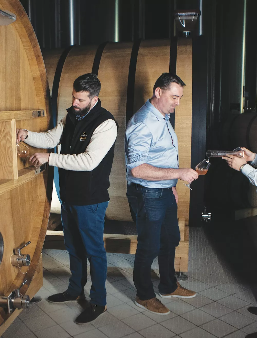 Winemaker David Chaboche and managing director Romain Lévêcque taste still wines at Champagne Collery