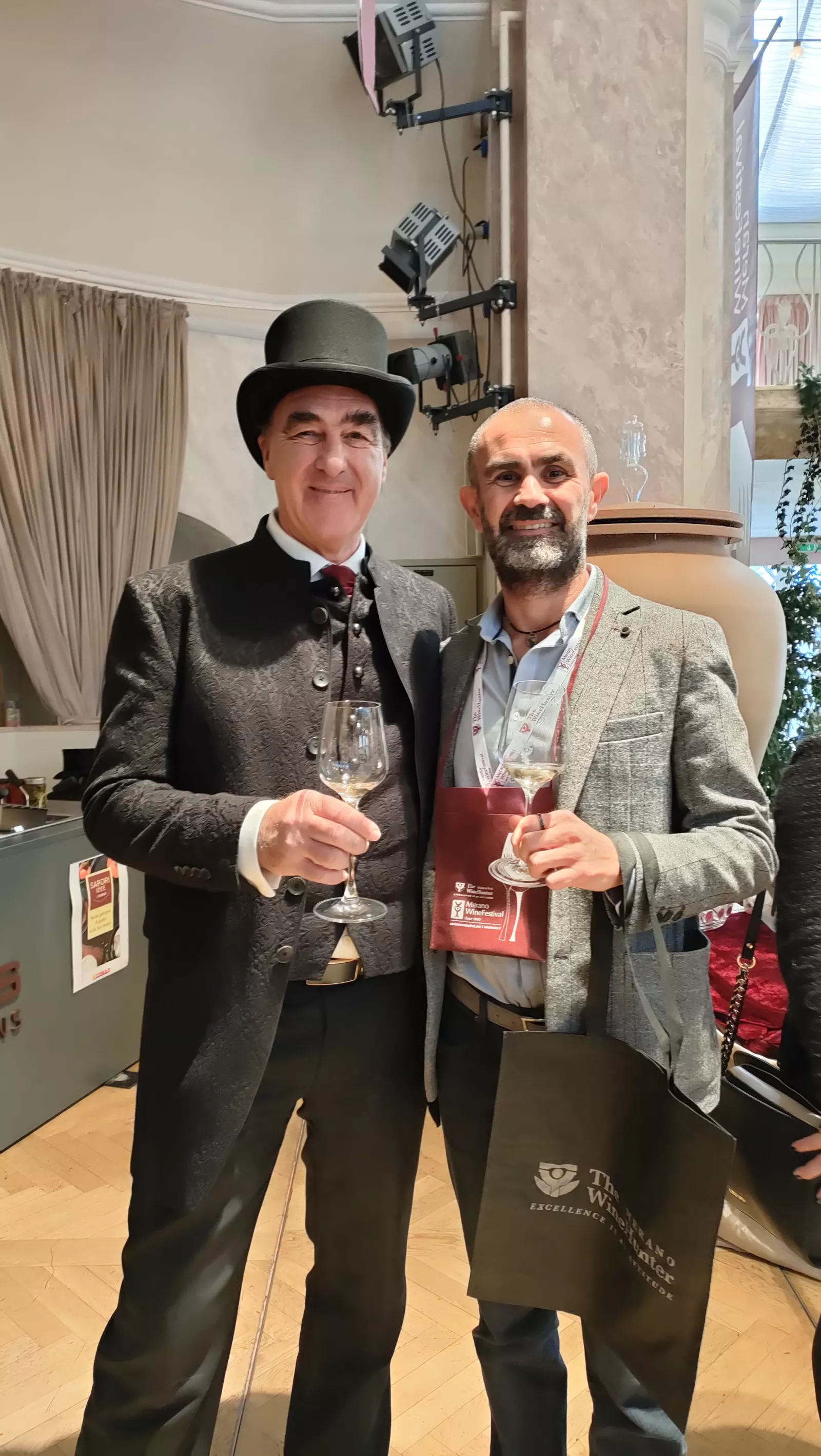 Alessandro Satin with Helmut Köcher, founder of the Merano Wine Festival, in a top hat